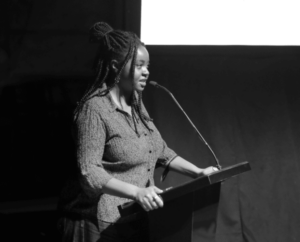 Playwright Ife Olujobi speaks at the 2024 TCG NC opening plenary "From the Ashes." (Photo by Elías Carmona Rivera.)